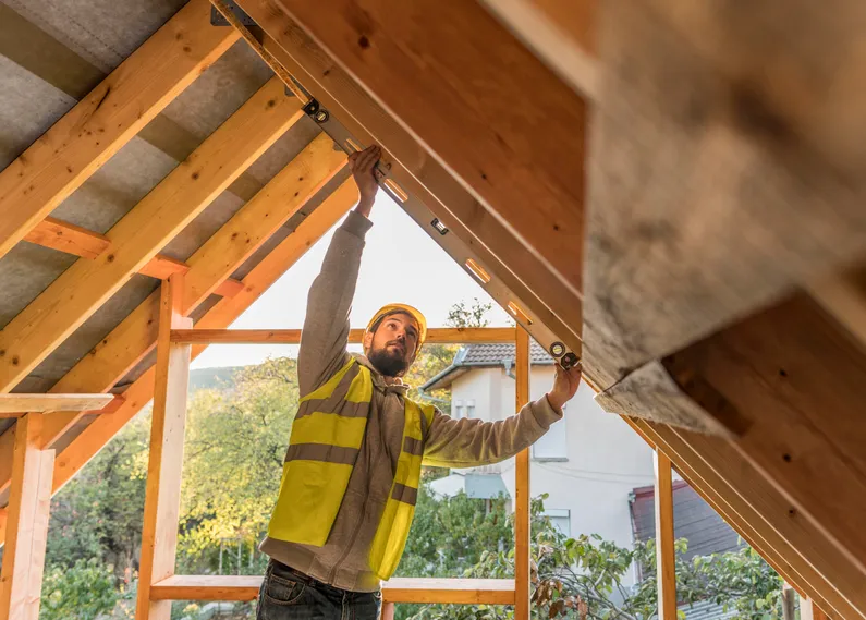 A construction worker working on a home addition.