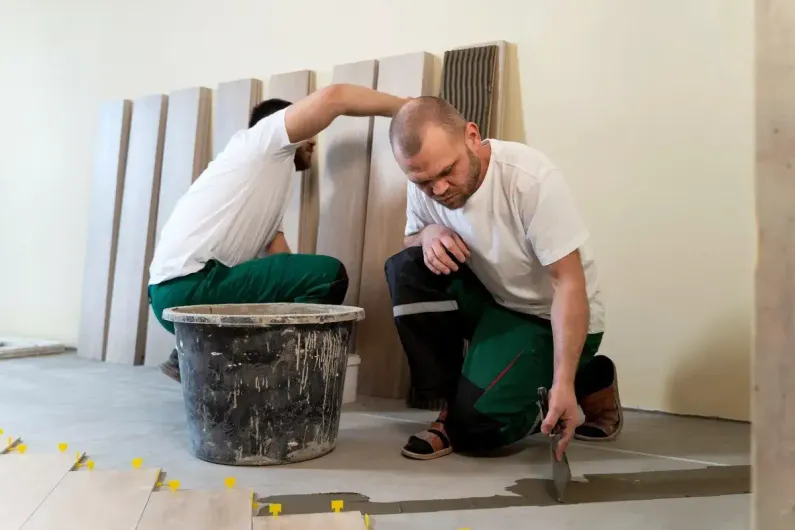 People working on a basement